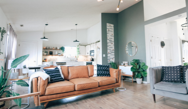 Modern living area green walls beige sofa